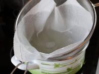 Strain the finished broth through a paper kitchen...