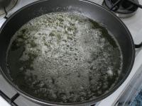 Pour oil into a pan, add a piece of butter and...