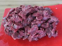 Wash the meat and cut it into cubes....