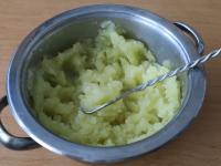 Strain the water from the boiled potatoes into a...