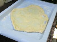 It is best to place a small langos on a tray with...