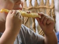 Serve langos with garlic, cream, grated cheese,...