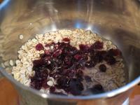 Put flakes into a pot, add washed cranberries and...