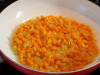Add carrots to the pan and continue frying,...