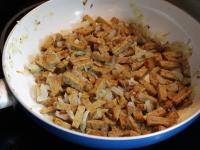 Add sliced tempeh to the onion and fry until...