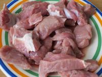 Wash the meat and cut it into cubes....