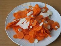 Clean the vegetables and cut them into thin...