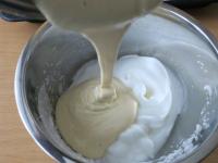 Mix the whipped egg yolks with the whipped egg...