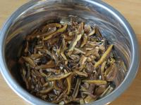 Wash the mushrooms and soak them in water....