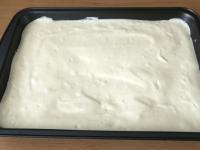 Spread the dough evenly on a baking sheet (22x32...