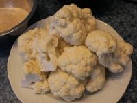 Wash the cauliflower and divide it into larger...