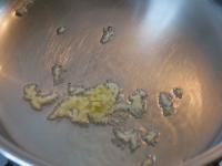 Clean the garlic, grate and fry in oil....