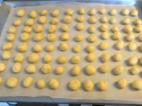 Put the balls on a baking sheet lined with baking...