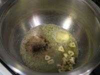 Melt the butter in a pot, fry garlic and warm the...