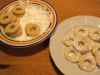 Coat the warm rings in powdered sugar. Let cool...