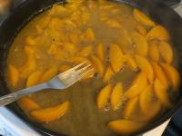 Mash the peaches, add wine and cook....