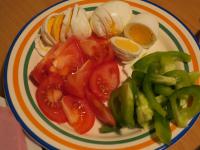 Boil the eggs hard, cool, peel and cut into thin...