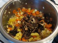 Add drained mushrooms ......