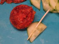 Put a cucumber on the wooden skewer. Roll the...