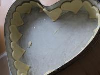 Grease the mold with butter and sprinkle with...