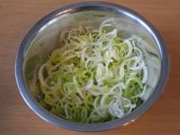 Wash the leek, cut it lengthwise and then into...