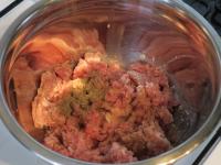 Put the meat in a bowl, add salt and pepper....