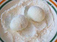 Coat the boiled eggs in flour....