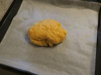 Knead the dough and place it on a larger baking...