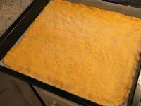 Roll the dough evenly on the baking sheet or press...