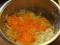 Grate the carrots coarsely and add to the cabbage....