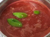 Put the tomato puree in the pot and add water. Add...