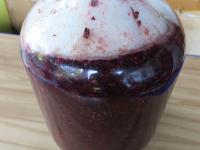 Pour the grape mix into a 10 liter demijohn and...