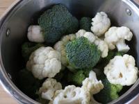 Cut the cauliflower and broccoli into florets....