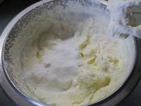 Whip whipping cream into firm peaks....
