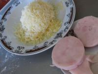 Grate the cheese and cut the ham into wheels with...