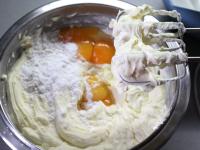 Add egg yolks and pudding to the cream. Mix with a...
