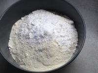 Add flour with baking powder to the dough. Mix...