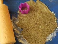 Roll the dough in portions on a floured board to a...