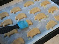 Put the cutted shapes on a baking sheet lined with...