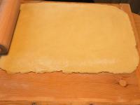 Roll out the dough on a floured board to a size of...