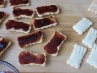Sprad half of the baked biscuits with
jam ......