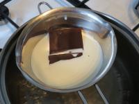 Heat the cream in a water bath and melt the...