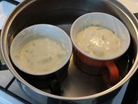 Put the cups in a pot and pour water up to handle...