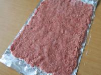 Put the meat on the foil and create a pancake form...