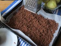 Grate one half of the dough on a baking sheet...