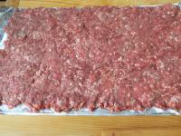 Put the meat on the foil and create a layer with...