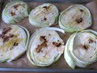 Put the cabbage on a baking sheet lined with...