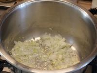 Peel and cut the onion and fry it in fat....