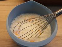 Mix sugar and egg yolks in the milk....
