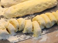 Sprinkle the board with a flour. Make three rolls...